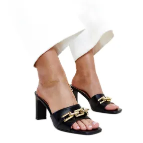 Black high-heeled mules with a Borislav chain